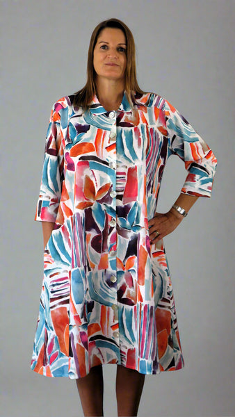 This coat dress is made from a soft white linen, with a beautiful all over colourful print. Perfect for any spring summer occasion, from a wedding - mother of the bride, mother of the groom and wedding guest to everyday wear. This coat dress will take you from day to night with effortless style and elegance.