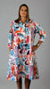 This coat dress is made from a soft white linen, with a beautiful all over colourful print. Perfect for any spring summer occasion, from a wedding - mother of the bride, mother of the groom and wedding guest to everyday wear. This coat dress will take you from day to night with effortless style and elegance.