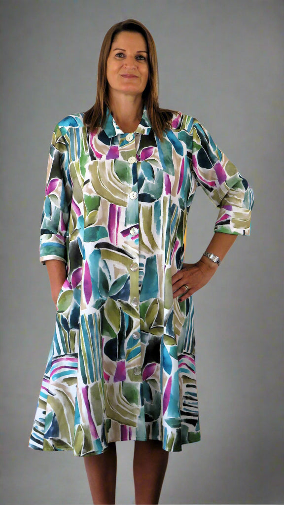This coat dress is made from a soft white linen, with a beautiful all over colourful print. Perfect for any spring summer occasion, from a wedding - mother of the bride, mother of the groom and wedding guest to everyday wear. This coat dress will take you from day to night with effortless style and elegance.