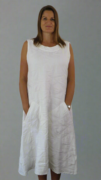 This white sleeveless dress is made from a soft feel tortoise shell fabric. Perfect for any spring summer occasion, from a wedding to everyday wear. This dress will take you from day to night with effortless style and elegance.