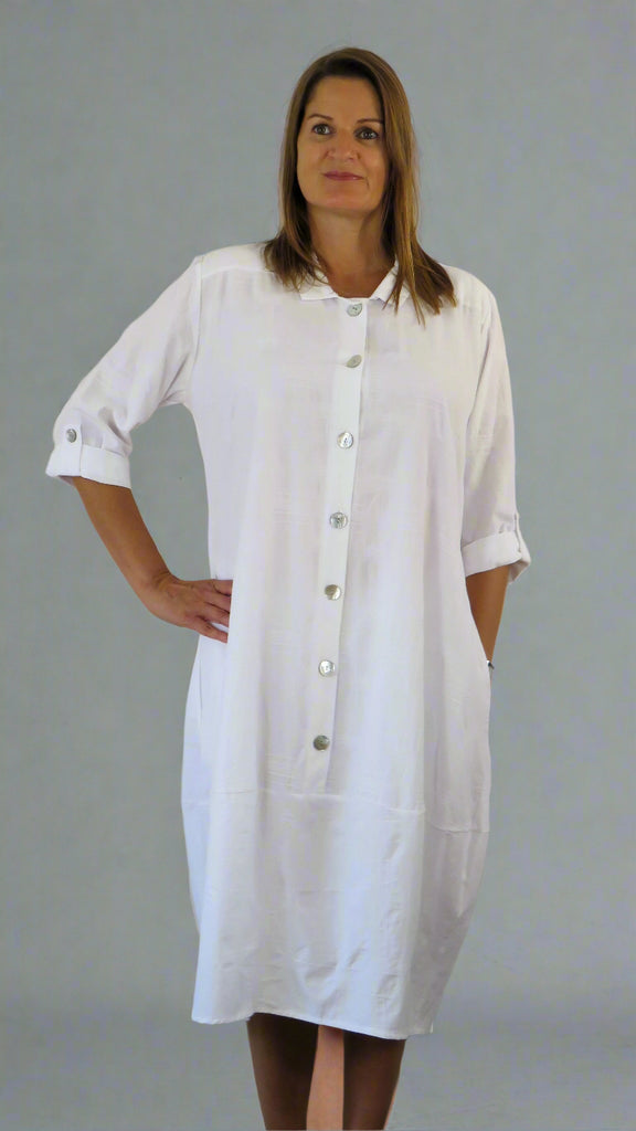 This button front dress has pockets and is made from a soft white linen, with an all over cross stitch design. Perfect for any spring summer occasion or everyday wear. This dress will take you from day to night with effortless style and elegance.