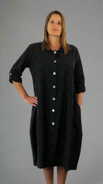 This button front dress has pockets and is made from a soft black linen, with an all over cross stitch design. Perfect for any spring summer occasion or everyday wear. This dress will take you from day to night with effortless style and elegance.
