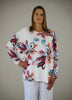 This wide top is made from a soft feel white jersey, with a beautiful all over multi colour print. Perfect for any spring summer occasion, from a wedding to any celebration to everyday wear. The wide top will take you from day to night with effortless style and elegance.