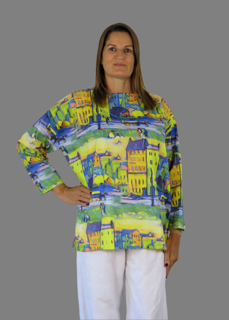 Woman wearing a colorful patterned blouse 