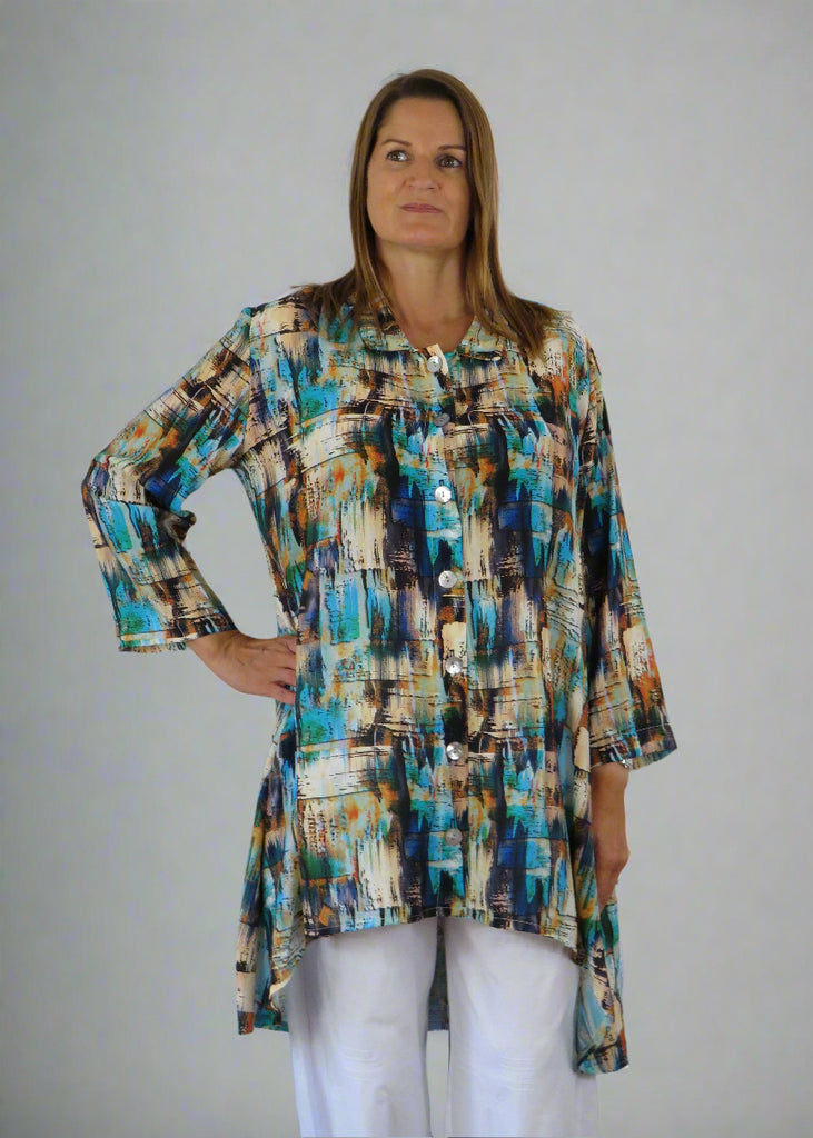 This Tunic Blouse is made from a soft viscose, with a beautiful multi colour print.  Perfect for any spring summer occasion, from a wedding to a party and everyday wear. This tunic blouse will take you from day to night with effortless style and elegance.