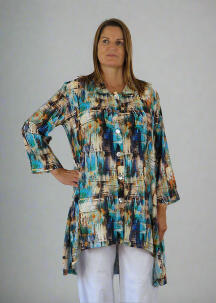 This Tunic Blouse is made from a soft viscose, with a beautiful multi colour print.  Perfect for any spring summer occasion, from a wedding to a party and everyday wear. This tunic blouse will take you from day to night with effortless style and elegance.