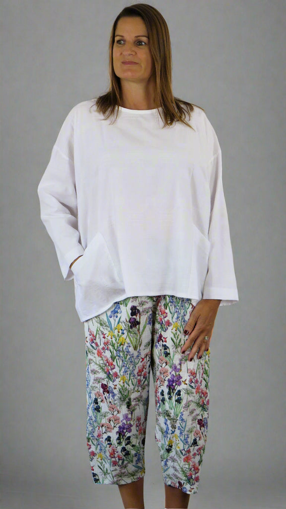 The trousers are made from a soft white cotton fabric, with a beautiful all over flower print in spring summer colours. Perfect for any occasion, wedding, party or everyday. These trousers will take you from day to night with effortless style and elegance.