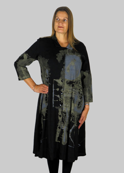 This shirt dress is made from a beautiful black fabric with a gold design. Perfect for any autumn winter occasion, from a wedding, Mother of the Bride, Mother of the Groom, Wedding Guest to a party or everyday wear. This dress will take you from day to night with effortless style and elegance.