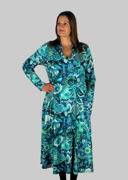 This V Collar dress is made from a soft feel blue jersey fabric, with an all over shades of blue print. Perfect for any autumn / winter occasion from a wedding, mother of the bride, mother of the groom to a party or everyday wear. This dress will take you from day to night with effortless style and elegance. Available in Abstract Aqua, Fuchsia & Green,& Fusion Aqua &  Gold