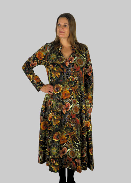 This V Collar dress is made from a soft feel brown jersey fabric, with an all over gold print. Perfect for any autumn / winter occasion from a wedding, mother of the bride, mother of the groom to a party or everyday wear. This dress will take you from day to night with effortless style and elegance. Available in Abstract Aqua, Fuchsia & Green,& Fusion Aqua & Gold.