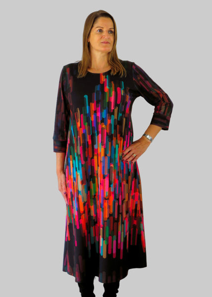 This panel dress is made from a soft feel black jersey fabric, with an all over multicolour print. Perfect for any autumn / winter occasion from a wedding, mother of the bride, mother of the groom to a party or everyday wear. This dress will take you from day to night with effortless style and elegance.