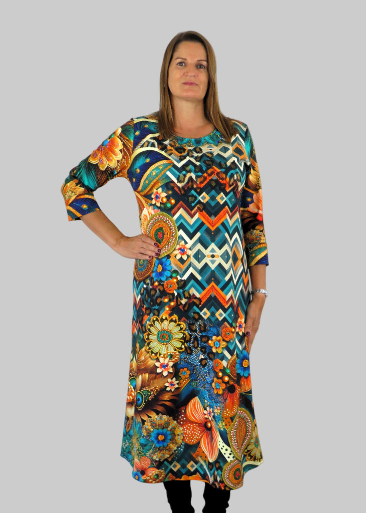 This panel dress is made from a soft feel jersey fabric, with an all over multicolour print. Perfect for any autumn / winter occasion from a wedding, mother of the bride, mother of the groom to a party or everyday wear. This dress will take you from day to night with effortless style and elegance.