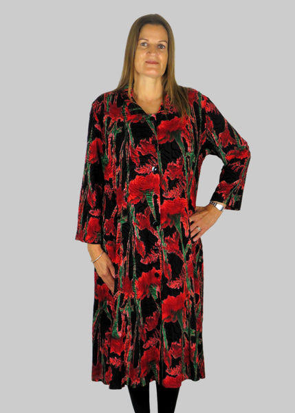 This shirt dress is made from a beautiful embossed black fabric with an red rose design. Perfect for any autumn winter occasion, from a wedding, Mother of the Bride, Mother of the Groom, Wedding Guest to a party or everyday wear. This dress will take you from day to night with effortless style and elegance.