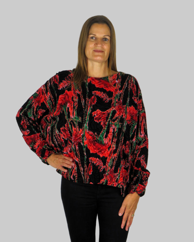 This wide top is made from a embossed red rose fabric. Perfect for any autumn winter occasion, from a party to everyday wear. This top will take you from day to night with effortless style and elegance.