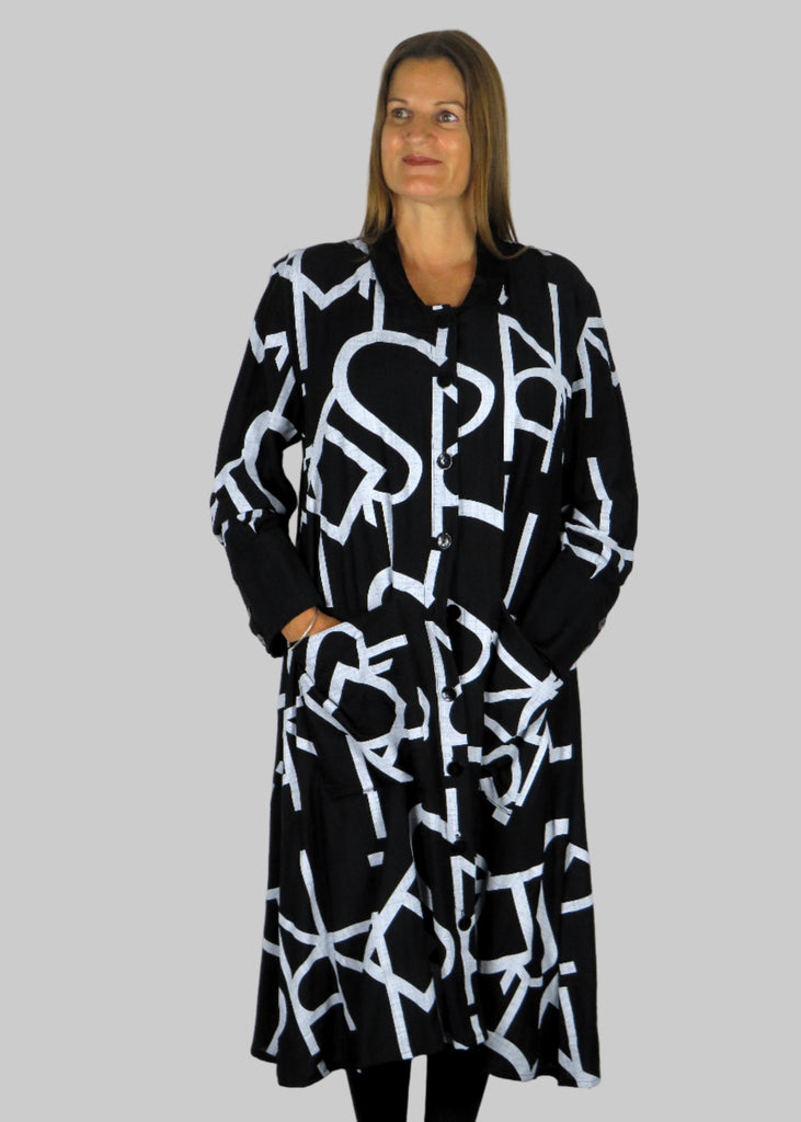 This coat is made from a beautiful soft black cotton with a white print. Perfect for any autumn winter occasion, from a wedding, Mother of the Bride, Mother of the Groom, Wedding Guest to a party or everyday wear. This coat will take you from day to night with effortless style and elegance. Please note : This coat is unlined