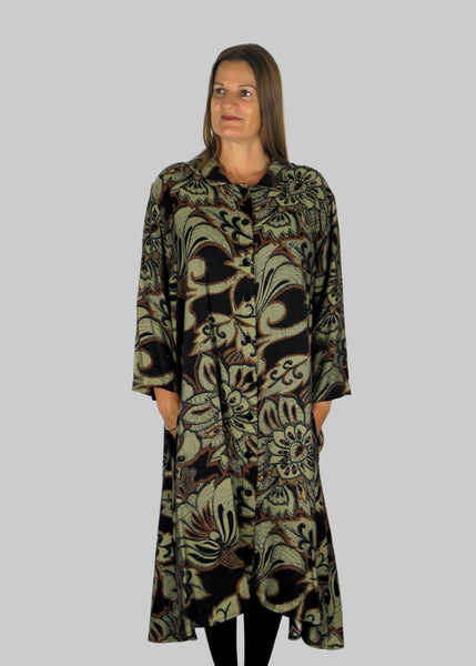 This shirt dress is made from a beautiful black fabric with an all over brown and grey print. Perfect for any autumn winter occasion, from a wedding, Mother of the Bride, Mother of the Groom, Wedding Guest to a party or everyday wear. This dress will take you from day to night with effortless style and elegance.