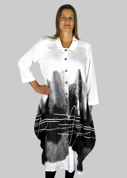 This shirt dress is made from a white cotton fabric with a grey and black print. Perfect for any autumn winter occasion, from a wedding, Mother of the Bride, Mother of the Groom, Wedding Guest to a party or everyday wear. This dress will take you from day to night with effortless style and elegance