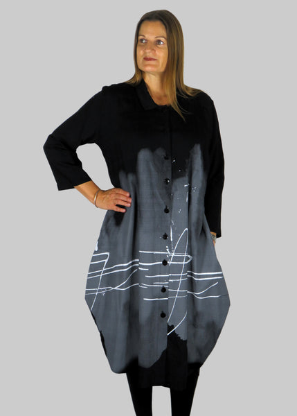 This shirt dress is made from a black cotton fabric with a grey and white print. Perfect for any autumn winter occasion, from a wedding, Mother of the Bride, Mother of the Groom, Wedding Guest to a party or everyday wear. This dress will take you from day to night with effortless style and elegance.