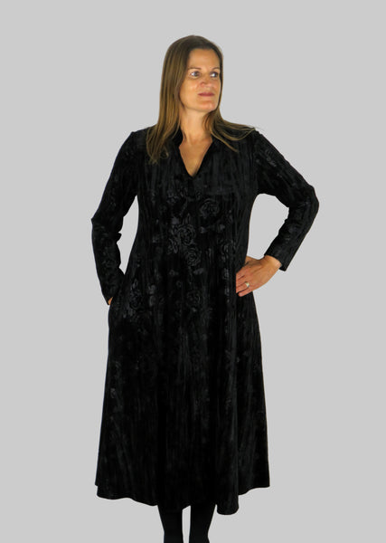 The collar dress is made from a soft stretch black viscose velvet fabric, with an embossed flower all over design. Perfect for any autumn winter occasion, from a wedding, Mother of the Bride, Mother of the Groom, Wedding Guest to a party or everyday wear. This dress will take you from day to night with effortless style and elegance.