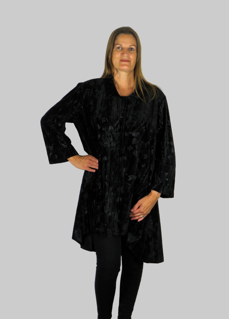 This tunic blouse is made from a soft stretch black viscose velvet fabric, with an embossed flower all over design. Perfect for any autumn winter occasion, from a party to everyday wear. This blouse will take you from day to night with effortless style and elegance.