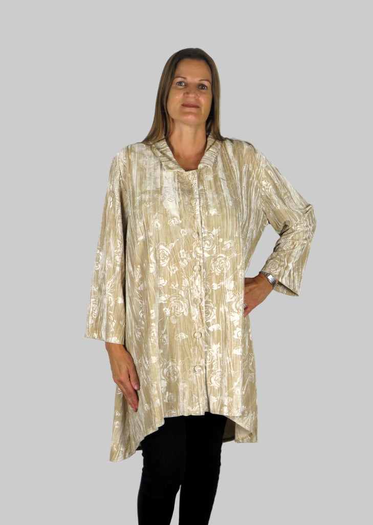 This tunic blouse is made from a soft stretch cream viscose velvet fabric, with an embossed flower all over design. Perfect for any autumn winter occasion, from a party to everyday wear. This blouse will take you from day to night with effortless style and elegance
