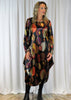 The dress is made from a soft stretch viscose velvet fabric,  with a beautiful all over brown autumnal design. The dress has a hitch up hem on both sides, which can be buttoned up or let down for a longer length. Perfect for any autumn winter occasion, from a wedding Mother of the Bride, Mother of the Groom, Wedding Guest to a party or everyday wear. This dress will take you from day to night with effortless style and elegance.