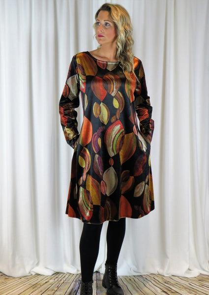 The dress is made from a soft stretch viscose velvet fabric, with a beautiful all over brown autumnal design. Perfect for any autumn winter occasion, from a wedding Mother of the Bride, Mother of the Groom, Wedding Guest to a party or everyday wear. This dress will take you from day to night with effortless style and elegance.