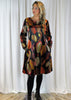 The dress is made from a soft stretch viscose velvet fabric, with a beautiful all over brown autumnal design. Perfect for any autumn winter occasion, from a wedding Mother of the Bride, Mother of the Groom, Wedding Guest to a party or everyday wear. This dress will take you from day to night with effortless style and elegance.