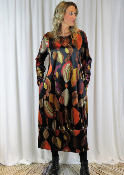 The dress is made from a soft stretch viscose velvet fabric, with a beautiful all over brown autumnal design. Perfect for any autumn winter occasion, from a wedding Mother of the Bride, Mother of the Groom, Wedding Guest to a party or everyday wear. This dress will take you from day to night with effortless style and elegance.