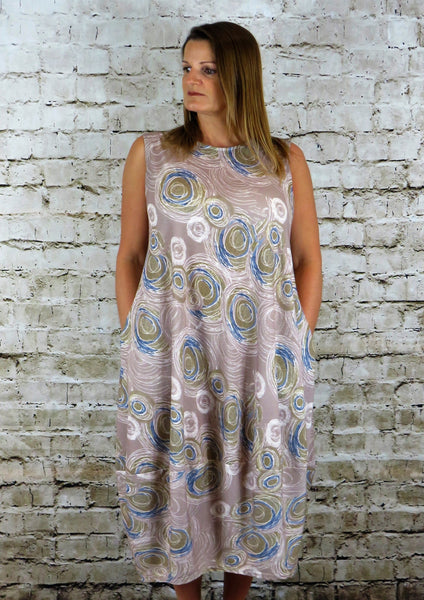 This sleeveless bell hem dress is made from a soft feel jersey fabric, with a beautiful all over multi colour print. Perfect for any spring summer occasion or everyday wear. This dress will take you from day to night with effortless style and elegance. Available in Black, Charcoal, Lime and Sand.
