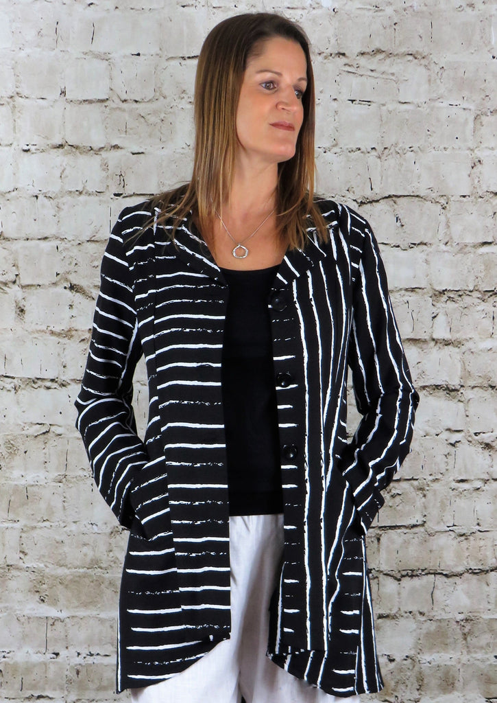 The riding jacket is made from a soft black linen, with an all over white print. The jacket has a beautiful frill back and front pockets. Perfect for any spring summer occasion, from a wedding to any celebration or everyday wear. This jacket will take you from day to night with effortless style and elegance.