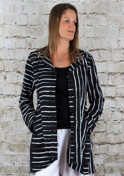 The riding jacket is made from a soft black linen, with an all over white print. The jacket has a beautiful frill back and front pockets. Perfect for any spring summer occasion, from a wedding to any celebration or everyday wear. This jacket will take you from day to night with effortless style and elegance.