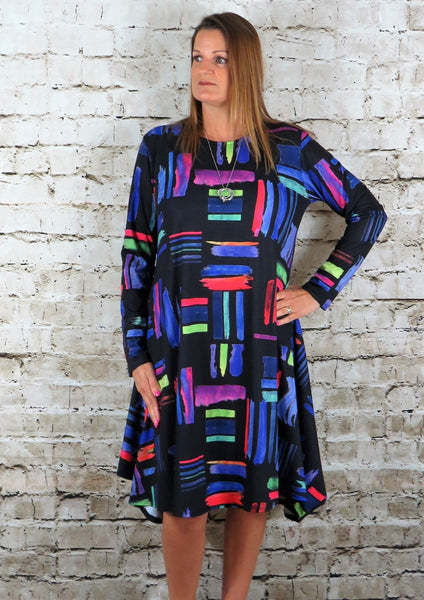 This flared dress is made from a soft feel black and white jersey fabric, with a beautiful all over multi colour print. Perfect for any spring summer occasion or everyday wear. This dress will take you from day to night with effortless style and elegance.